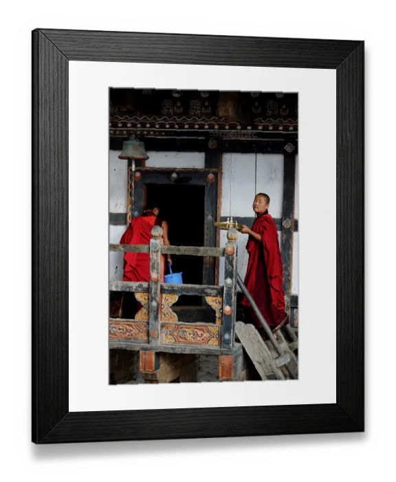 Framed Print : Monks on the site of the monastery of the castle fortress of Trongsa Dzong