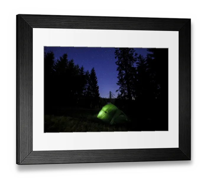 Framed Print : Illuminated green tent at the edge of the forest