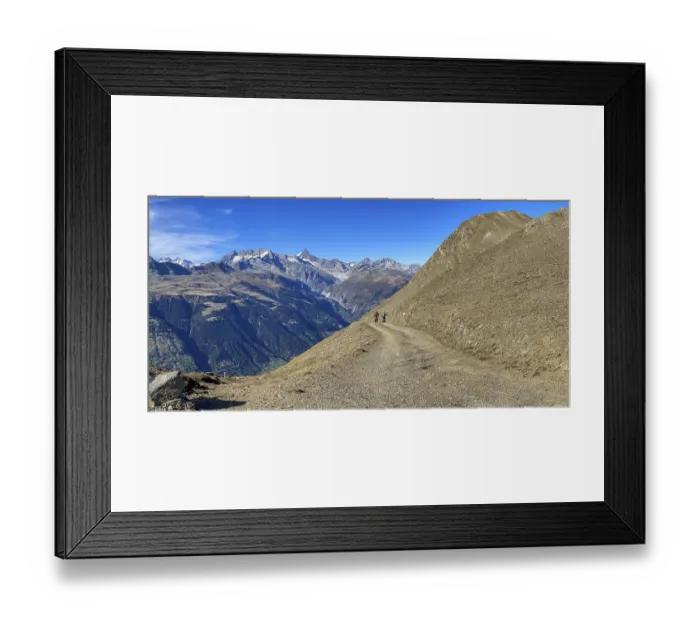 Framed Print : Mountain biker on the Breithorn with panorama over the Upper Valais to the Aletsch area with Eggishorn
