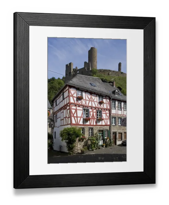 Framed Print : Half-timbered house and castle ruins