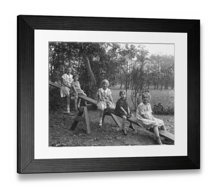 Framed Print : Five children on a seesaw, 1920s