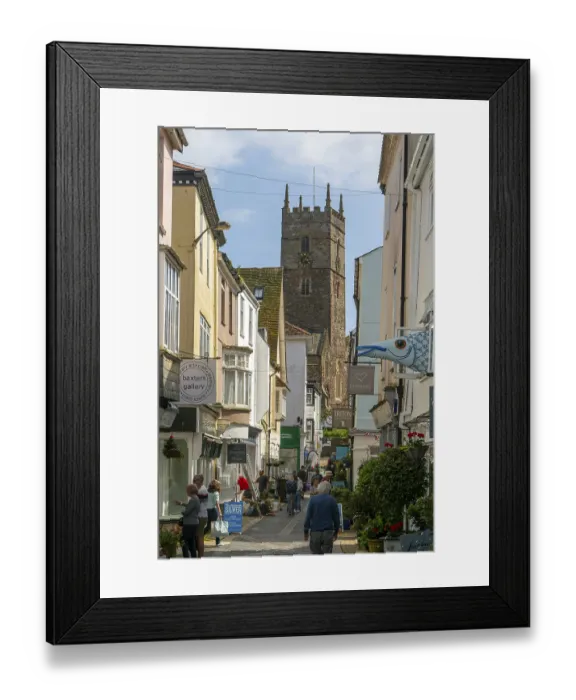 Framed Print : Shops in historic buildings along alleyway with tower of church of St Saviour