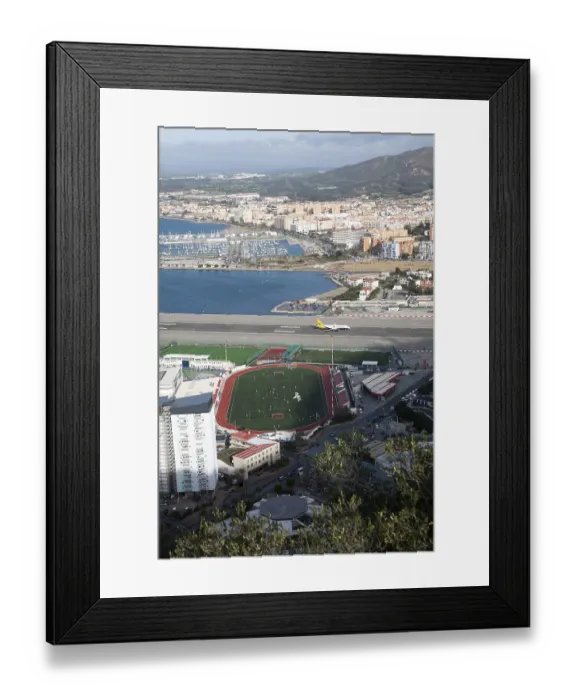 Framed Print : View over airport runway to Spanish town of La Linea from Gibraltar