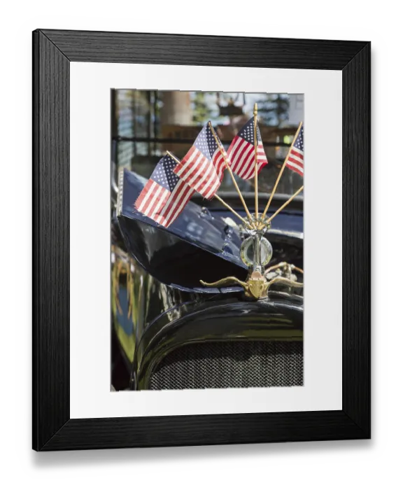 Framed Print : American flags on hood ornament of classic vintage car Framed Print : American flags on hood ornament of classic vintage car