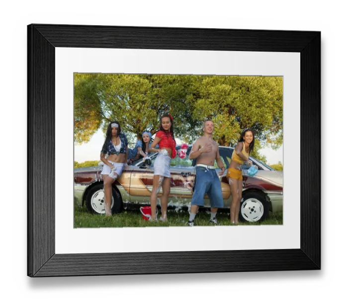 Framed Print : Cheerful young female friends in casual clothes standing near vintage car and looking at camera