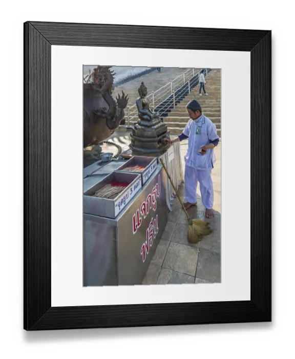 Framed Print : Worker cleaning Buddhist statue in fron of the Guan Yin (Goddess of Mercy)