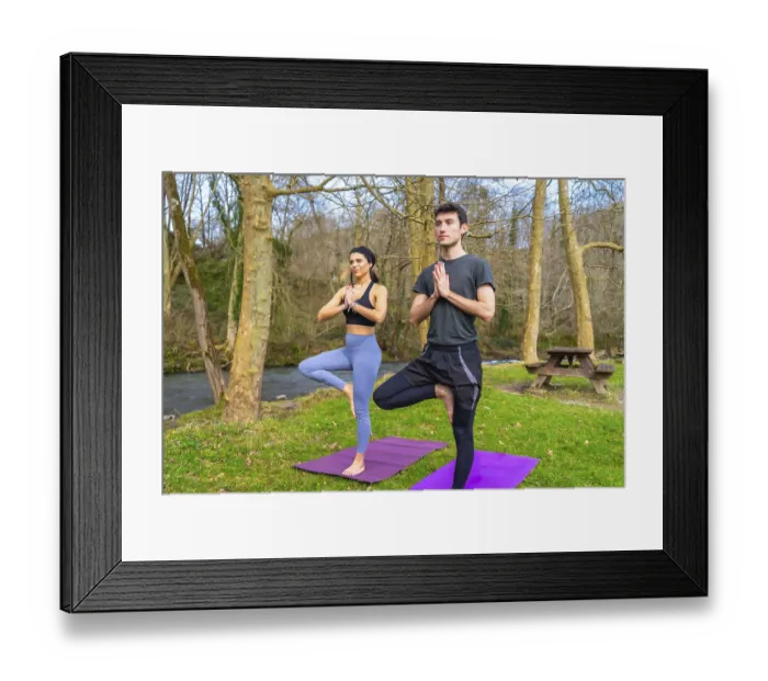 Framed Print : Yoga instructors performing the tree pose by a river in a forest Framed Print : Yoga instructors performing the tree pose by a river in a forest
