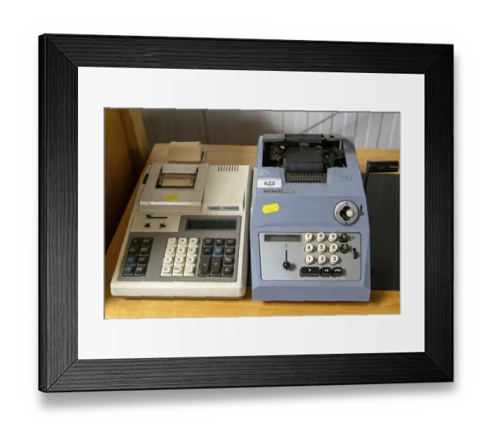 Framed Print : Vintage technology adding machines on sale at auction