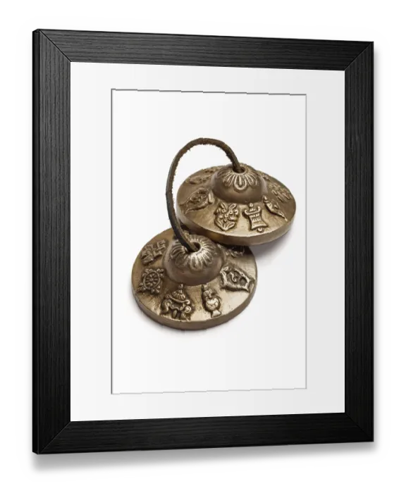 Framed Print : Tibetan Buddhist tingsha cymbals isolated on white