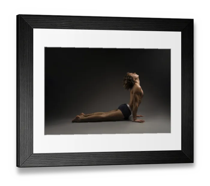 Framed Print : Side view of flexible young male in boxer briefs closing eyes