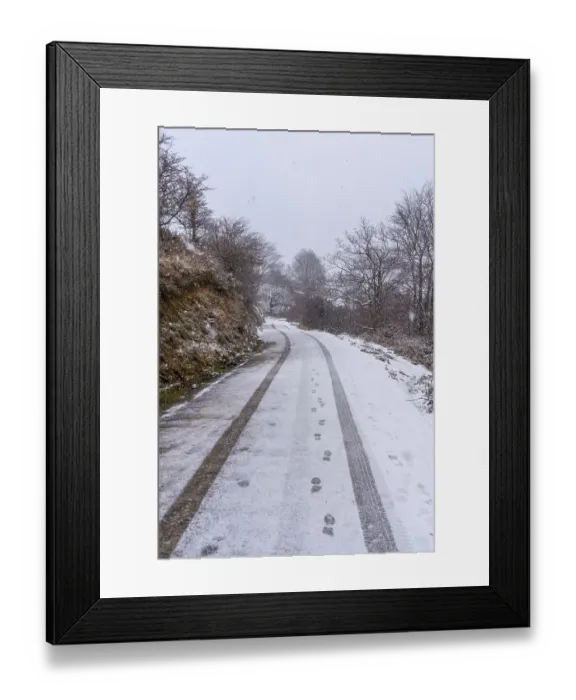 Framed Print : Car tracks on the road to mount aizkorri in gipuzkoa