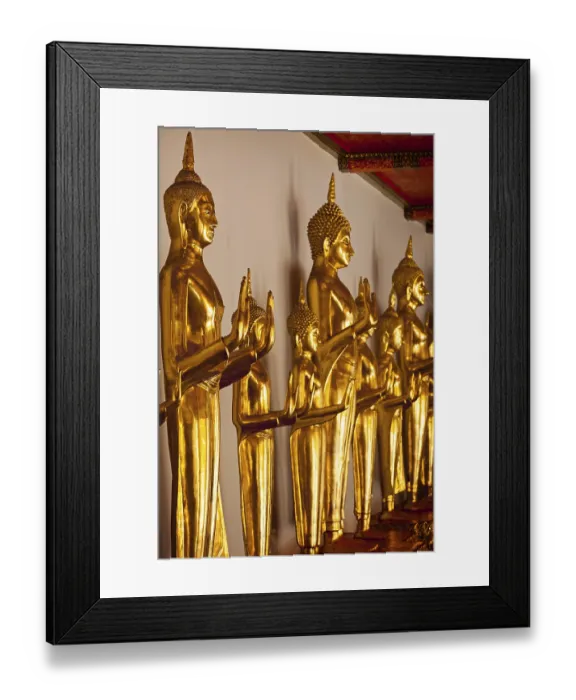 Framed Print : Standing golden Buddha statues close up