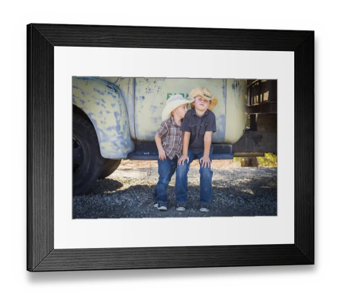 Framed Print : Two young boys wearing cowboy hats leaning against an antique truck in a rustic country setting Framed Print : Two young boys wearing cowboy hats leaning against an antique truck in a rustic country setting