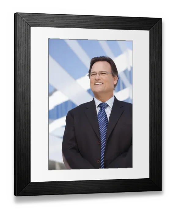 Framed Print : Handsome businessman smiling in suit and tie outside of corporate building