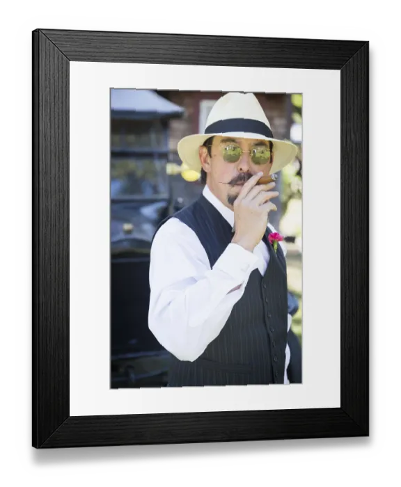 Framed Print : Handsome 1920s dressed man near vintage car smoking A cigar