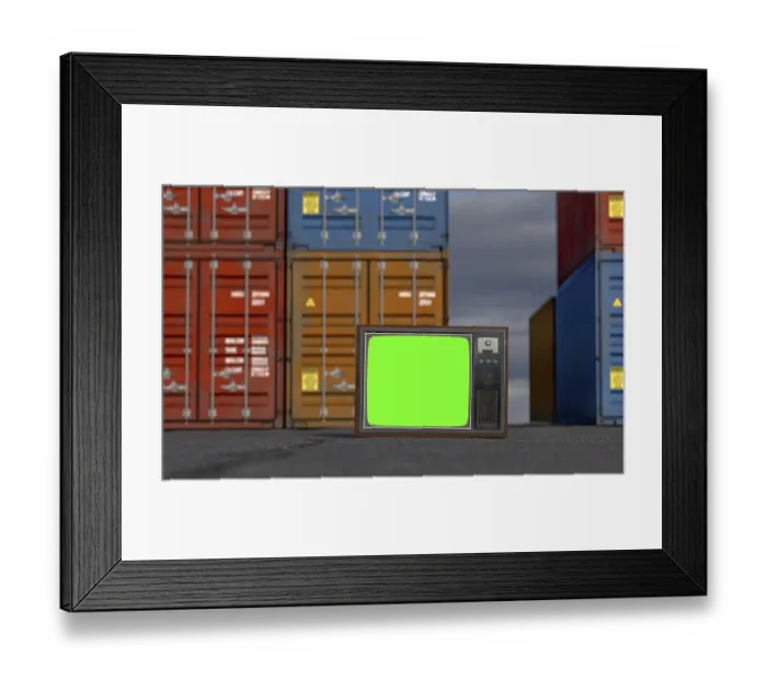 Framed Print : Vintage television with chroma green screen resting on shipping dock asphalt amongst stacked shipping containers