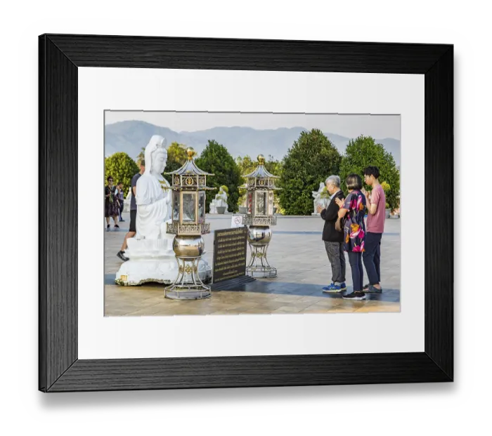 Framed Print : Visitors praying at the Guan Yin (Goddess of Mercy)