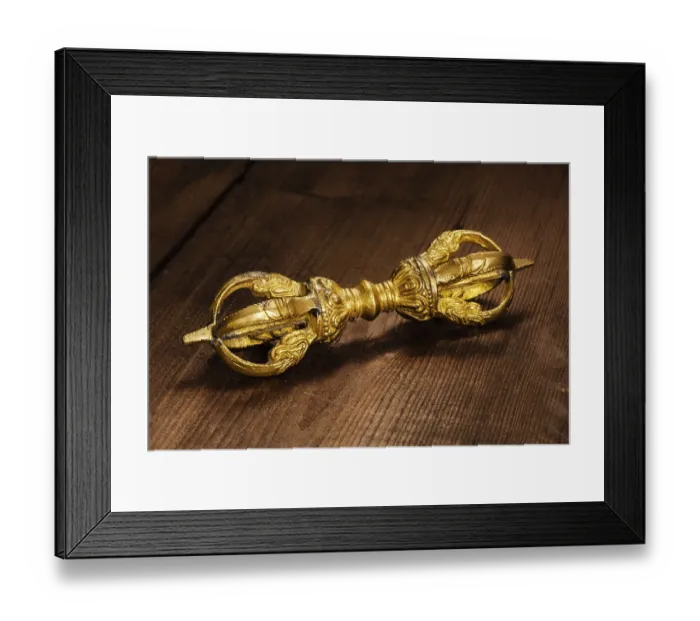Framed Print : Tibetan Buddhist Dorje vajra ceremonial item on wooden background