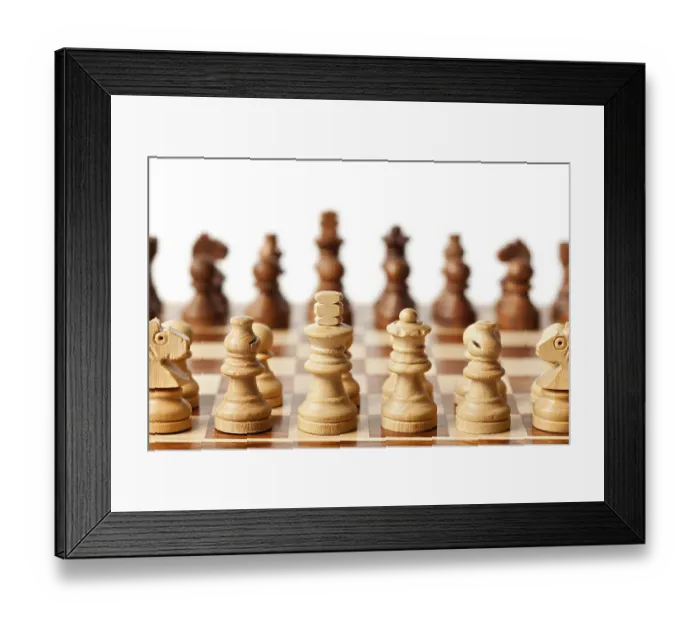 Framed Print : Wooden chess pieces on chessboard