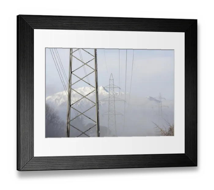 Framed Print : Electricity pylon with snow-capped mountain in Switzerland