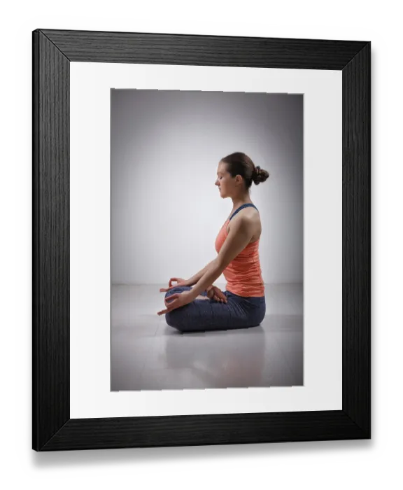 Framed Print : Beautiful fit yogini woman meditating in yoga asana Padmasana (Lotus pose) Framed Print : Beautiful fit yogini woman meditating in yoga asana Padmasana (Lotus pose)