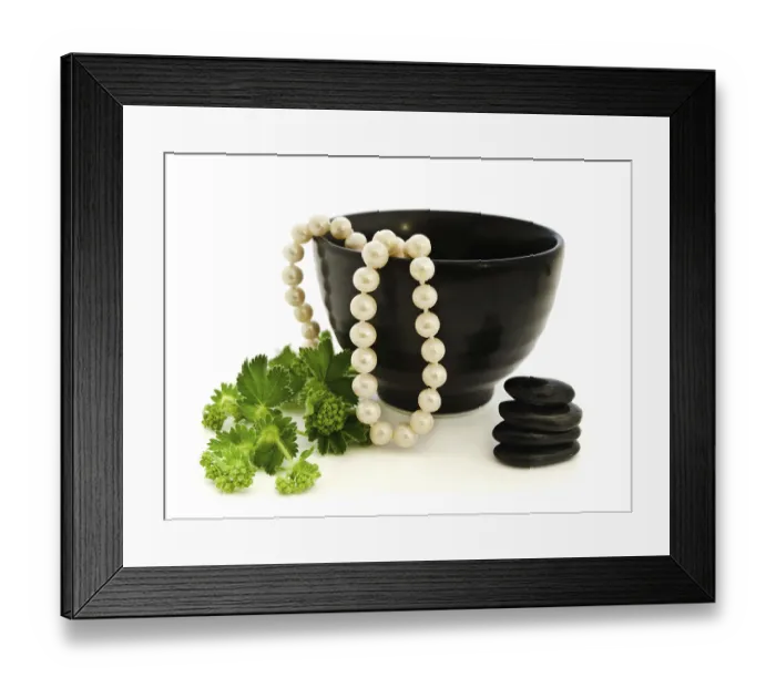 Framed Print : Relax theme with pearl beads, Zen stones and green herb over white background Framed Print : Relax theme with pearl beads, Zen stones and green herb over white background
