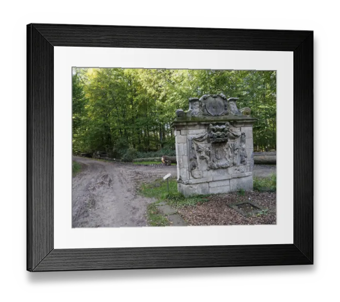 Framed Print : Stone monument at the edge of a forest along a path Framed Print : Stone monument at the edge of a forest along a path