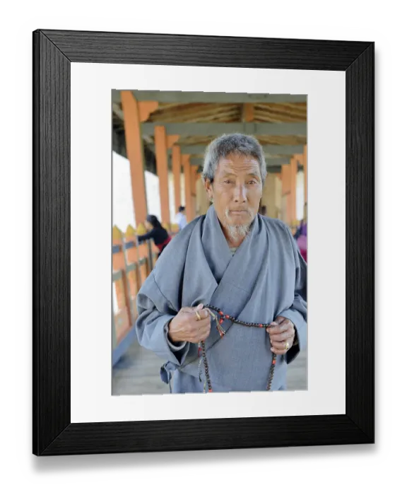 Framed Print : Woman on bridge, punakha dzong monastery