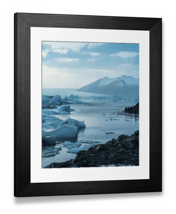 Framed Print : Vast glacier landscape with mountains and icebergs under a cloudy sky Framed Print : Vast glacier landscape with mountains and icebergs under a cloudy sky