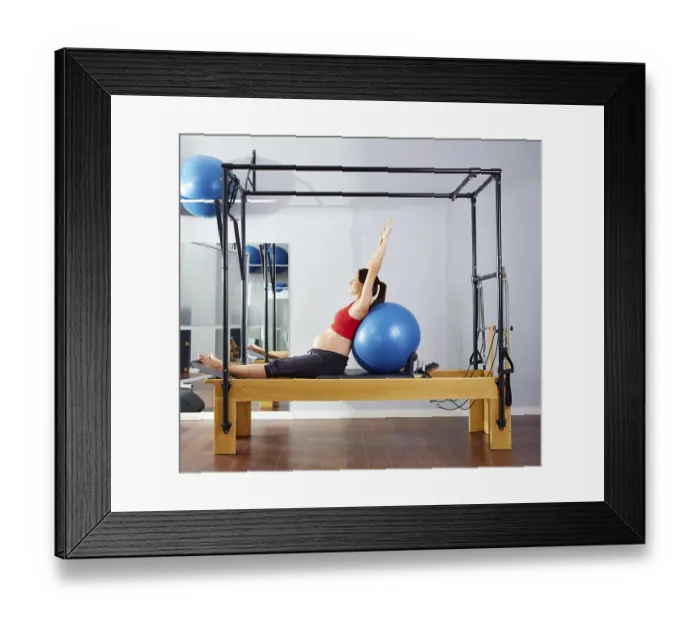 Framed Print : Pregnant woman pilates reformer fitball exercise workout at gym