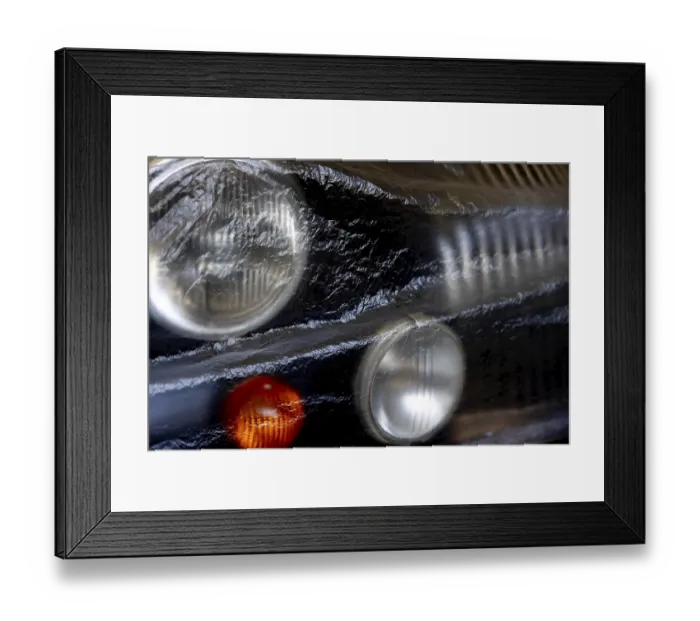 Framed Print : Car Lamps on the Front of a an Old Classic Car Covered with Plastic Protection in Switzerland Framed Print : Car Lamps on the Front of a an Old Classic Car Covered with Plastic Protection in Switzerland