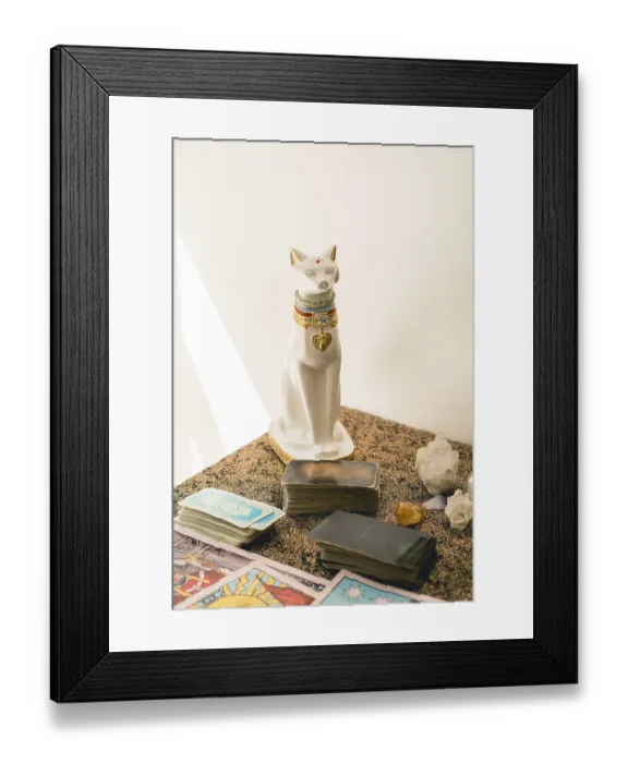 Framed Print : Set of a tarot reader on a table featuring various tarot decks