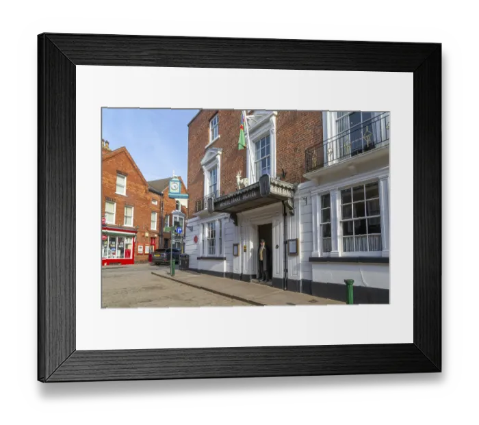 Framed Print : Doorman standing in entrance door of historic White Hart Hotel Framed Print : Doorman standing in entrance door of historic White Hart Hotel