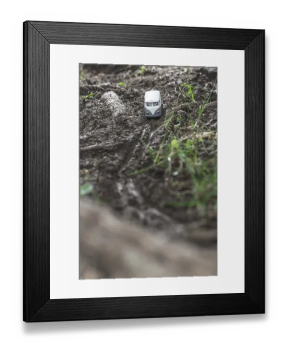 Framed Print : Vintage bus VW. Small metal toy in the nature