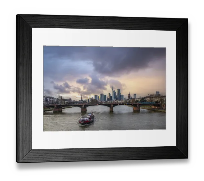 Framed Print : A big city in the evening at sunset