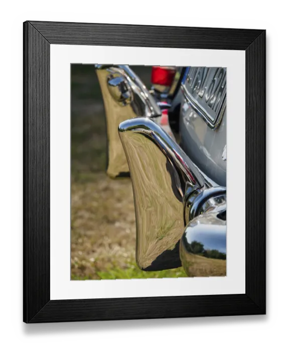 Framed Print : Close-up of a shiny chrome bumper of a classic car