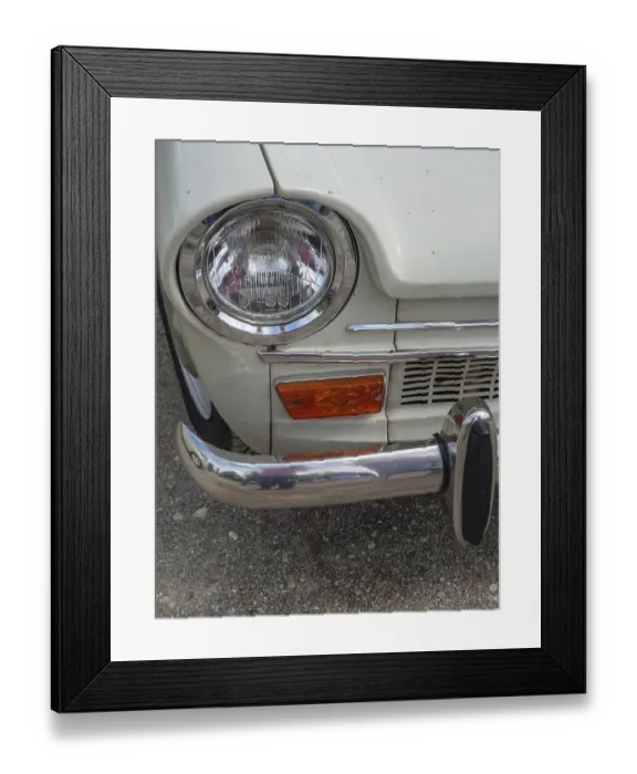 Framed Print : Close-up of a vintage car, showing the front headlight and part of the bumper