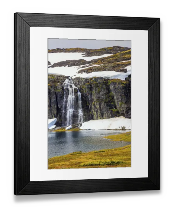 Framed Print : Tall waterfall falls into the lake
