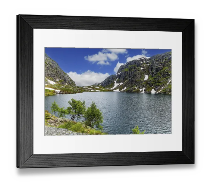Framed Print : Large snowfields is reflected in the water of the lake