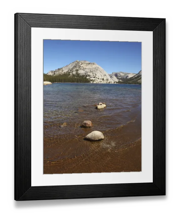 Framed Print : Shallow on the lake surrounded with mountains and woods