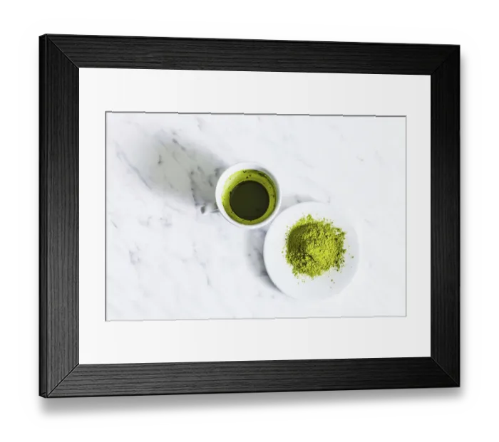 Framed Print : A cup of green matcha tea with matcha powder tea isolated on a light background Framed Print : A cup of green matcha tea with matcha powder tea isolated on a light background