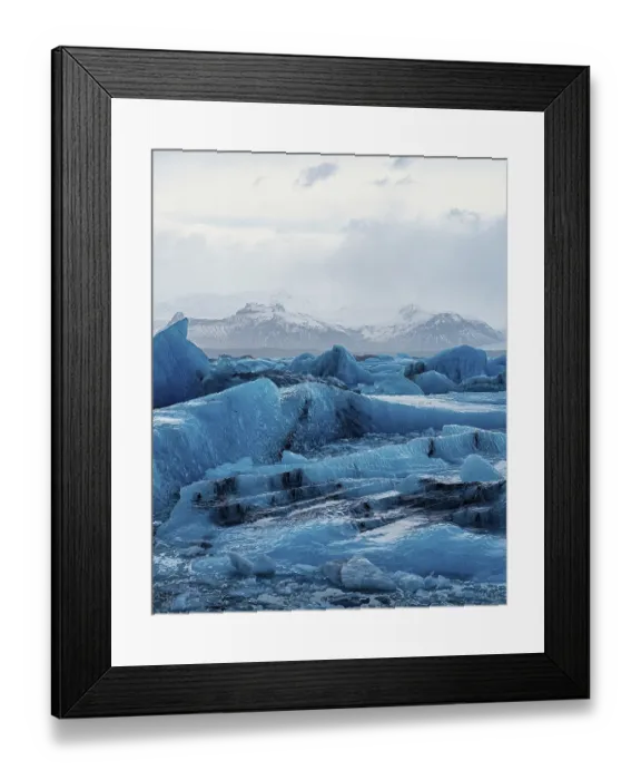 Framed Print : Blue glaciers stretch across the landscape with mountains in the distance Framed Print : Blue glaciers stretch across the landscape with mountains in the distance