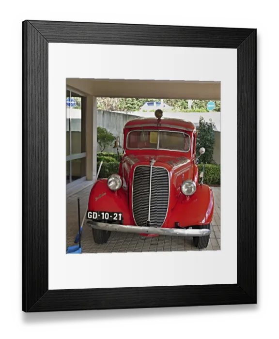 Framed Print : Shiny vintage Ford fire engine parked in a garage Framed Print : Shiny vintage Ford fire engine parked in a garage