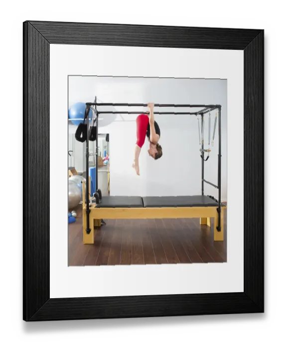 Framed Print : Pilates aerobic instructor woman in cadillac fitness exercise Framed Print : Pilates aerobic instructor woman in cadillac fitness exercise