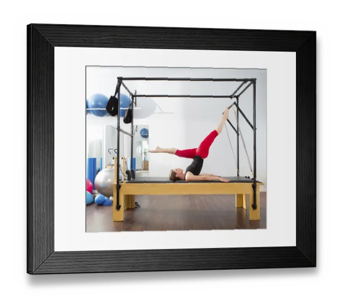 Framed Print : Pilates aerobic instructor woman in cadillac fitness exercise Framed Print : Pilates aerobic instructor woman in cadillac fitness exercise