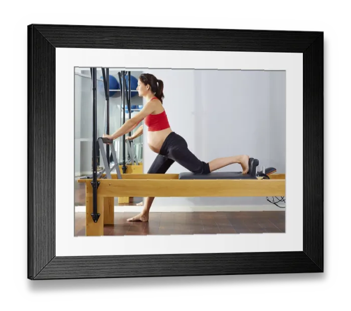 Framed Print : Pregnant woman pilates reformer cadillac exercise workout at gym Framed Print : Pregnant woman pilates reformer cadillac exercise workout at gym