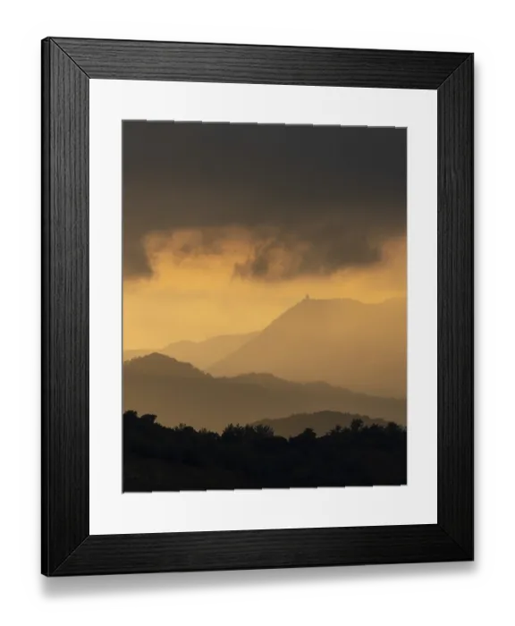 Framed Print : Sunset with stormy cloud sky and dramatic orange sunlight above mountain Troodos mountains Cyprus