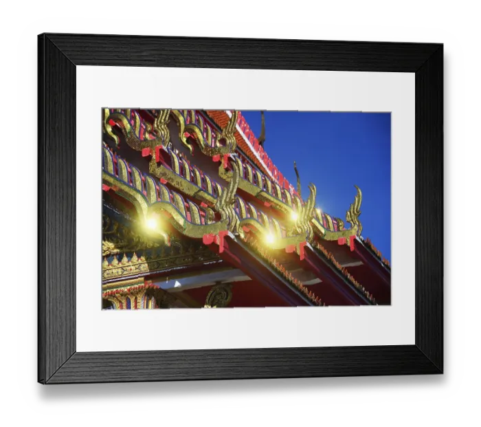 Framed Print : Roof ornaments and pagodas with reflections of the sun