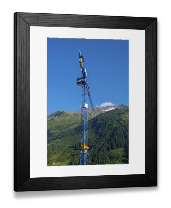 Framed Print : Construction Crane and swiss Alps with Blue Clear Sky and Sunlight in Andermatt Framed Print : Construction Crane and swiss Alps with Blue Clear Sky and Sunlight in Andermatt