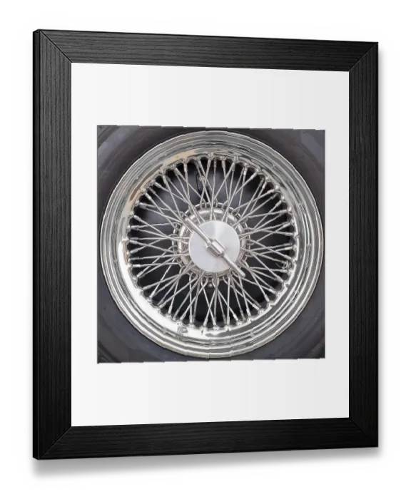Framed Print : Closeup detail of an old car tyre wheel with spokes